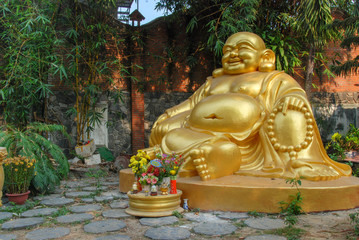 Golden statue of Buddha in Chua Phap Lam temple in Da Nang, Vietnam 