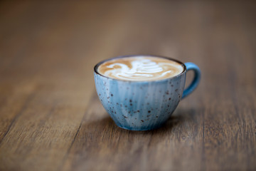 blue coffee mug on the wooden table