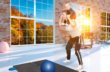 Kangatraining classes - young mothers with children in the gym