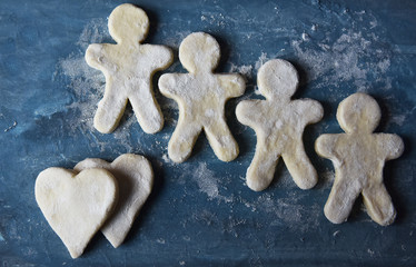 making Christmas cookies from dough