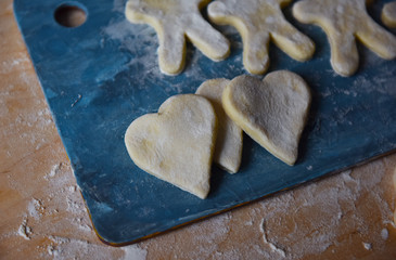 making Christmas cookies from dough