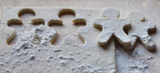 making Christmas cookies from dough