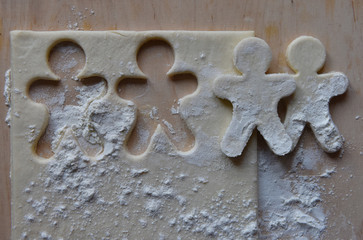 making Christmas cookies from dough