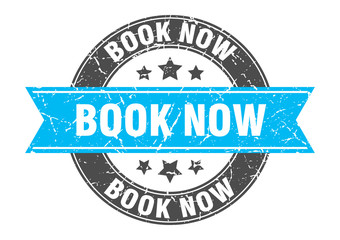 Fototapeta premium book now round stamp with turquoise ribbon. book now
