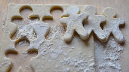 making Christmas cookies from dough