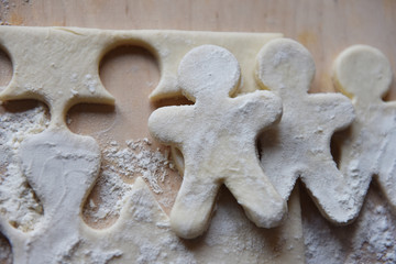 making Christmas cookies from dough