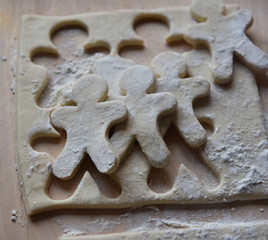 making Christmas cookies from dough