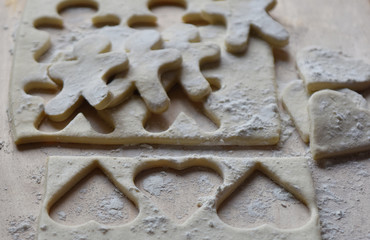 making Christmas cookies from dough