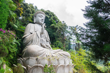 The iconic view of Large Stone Buddha Statue at Chin Swee Caves Temple, the Taoist temple in Genting Highlands, Pahang, Malaysia