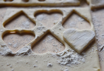 making Christmas cookies from dough