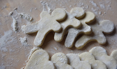 making Christmas cookies from dough