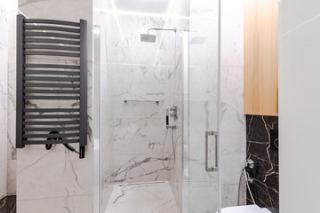 Marble tiled shower in a modern, stylish bathroom