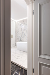 Stylish modern luxurious marble bathroom with original fixtures