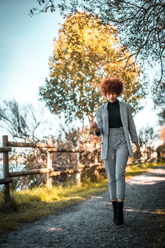 Lifestyle session, A young Dominican woman walking in autumn