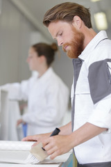 Obraz premium man painting house in diy concept