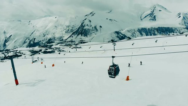 Mountain ski resort with a funicular railway. Ski elevator cable way in the mountains.