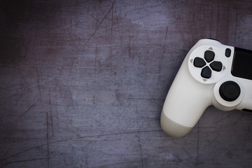 Video games white gaming controller isolated on dark moody background top view
