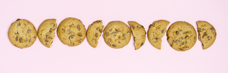 Traditional Chocolate Chip Cookies on Pink Background Long View Top Long Tasty Cookies
