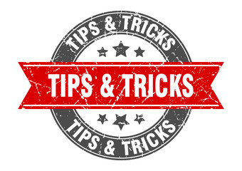 tips & tricks round stamp with red ribbon. tips & tricks