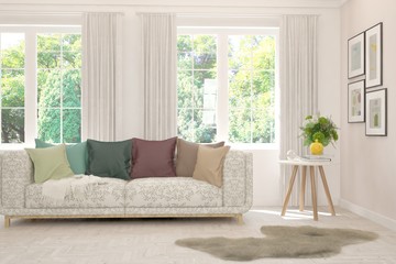 Stylish room in white color with sofa and summer landscape in window. Scandinavian interior design. 3D illustration