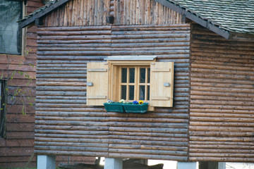 Fototapeta na wymiar window in an old wooden cottage