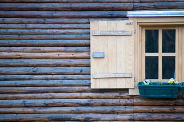 Obraz premium window in an old wooden cottage