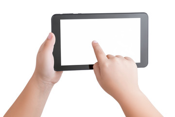 Top view closeup on hands of child holding a black tablet PC  with a blank white screen and a...