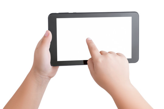 Top view closeup on hands of child holding a black tablet PC  with a blank white screen and a touching index finger in center of display. Mock up, copy space.  Child safety on the Internet concept