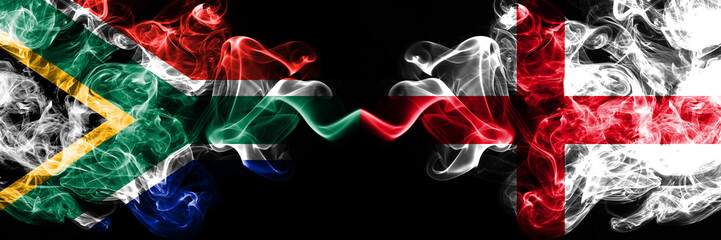 English vs South Africa, African smoky mystic flags placed side by side. Thick colored silky smokes flag of England and South Africa, African.