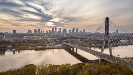 Fototapeta na wymiar Aerial view of Warsaw at Swietokrzyski Bridge at Vistula river at dawn