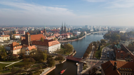 Fototapeta na wymiar Aerial view of Wroclaw on a sunny misty autumn morning