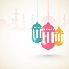 Glowing lanterns with mosque for Ramadan Kareem.