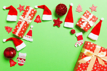 Top view of Christmas decorations on green background. New Year holiday concept with copy space