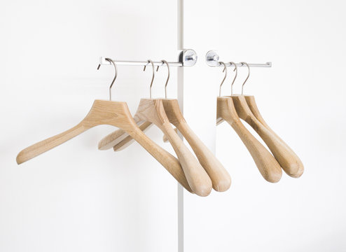 Vintage wooden coat hanger stand isolated on white background.. Vintage wooden coat hanger stand isolated on white background..