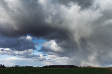 Obraz na płótnie Canvas Cloudy day in countryside of Latvia.
