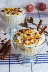 traditional creamy rice pudding with cinnamon, milk and raisins
