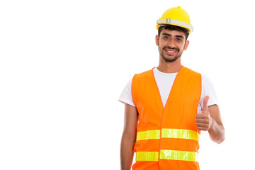 Young happy Persian man construction worker smiling while giving