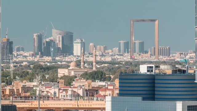 Skyline of the city with modern skyscrapers in Deira znd Zabeel district and blue sky on a sunny day aerial timelapse from Business Bay, Dubai, United Arab Emirates