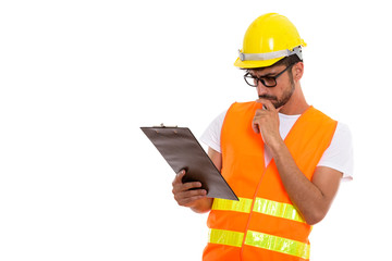 Studio shot of young Persian man construction worker thinking wh