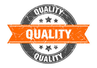 quality round stamp with orange ribbon. quality