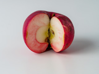 Organic red apple isolated on white background.