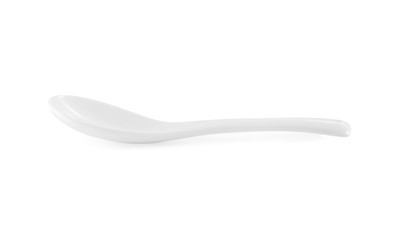 White empty ceramic spoon on white background