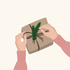  Hands wrapping stylish christmas gift box in eco paper and pine branches. Wrapping christmas gift. Vector illustration