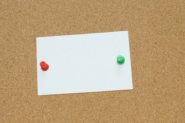 Sticky and pin blank paper notes on cork board to remind.