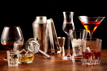 Assorted alcoholic beverages and bar utensils