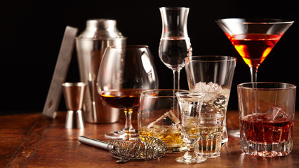 Bar utensils with an assortment of drinks