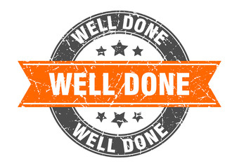 well done round stamp with orange ribbon. well done