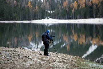 Tourist at Lake Braies, one of the most beautiful lakes in the Dolomites.