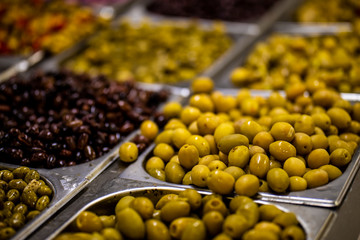 Different Olives are in steel Marmite