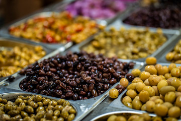 Different Olives are in steel Marmite